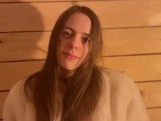 Girl in Fur Coat Chained to Wall and Toyed to Orgasm by Magic Wand