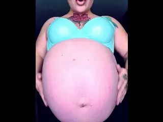 Rubbing Oiled Massive Pregnant Belly