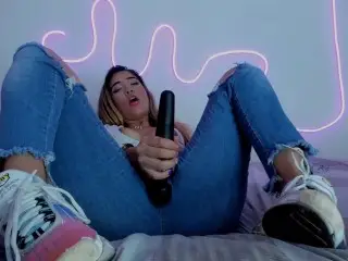 Sexy Blonde having an Amazing Orgasm with her Vibrator and Squirting in her Blue Jeans