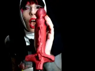 Blasphemous Nun Fucking with a Cross Dildo