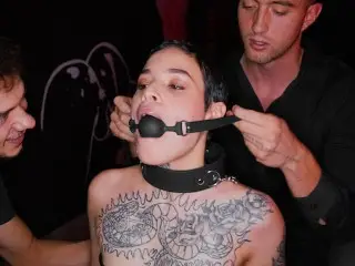 Obedient Tattooed Slut Gets Gagged and Dominated by two Rough Guys in BDSM Style