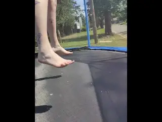 Slow Motion Jumping on a Trampoline in Shorts