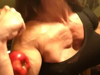 Muscle Girl Destroys Bad Apple with her Huge Bicep