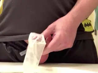 Hard Cock Pissing in a Condom