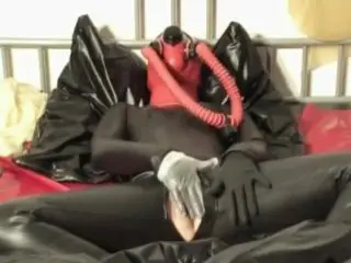 Girl in Heavy Rubber Latex Breath Play with Mask + Gag Mouth and Gas Mask