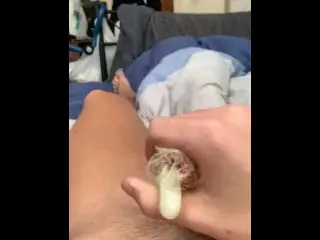 British Teen Jerks of Naked with Condom and Busts his Load in It.