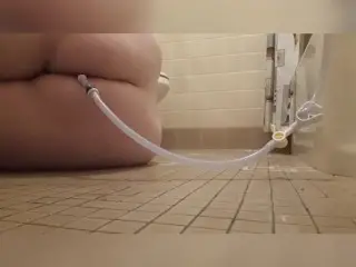 Chubby Girl Struggles Holding a 2-Quart Enema