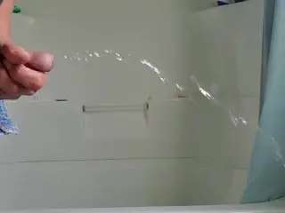 Squeezing my Cock while Pissing