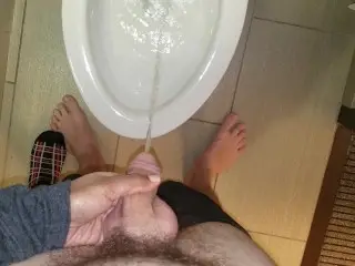 She Aims his Dick at the Hotel Toilet