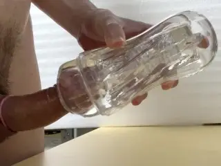 Cumshot inside of a Condom in a Transparent Sex Toy