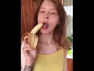 She Shows her Breasts and Eats a Banana Sexually.