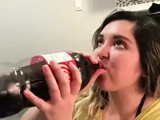 A girl, a cola, and her pizza