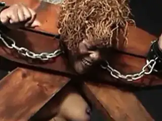 Masochistic black female enjoys bondage