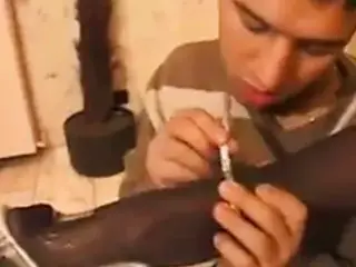 Hot milf gives a footjob with black pantyhose