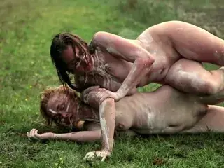 nude woman climbing another nude woman