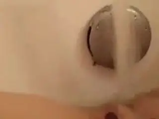 Shaved MILF water fun!