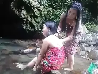 Beautiful girls having bath outdoor