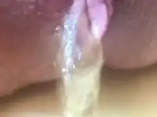 Evelle extreme close-up pissing and spreading