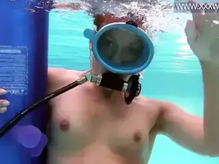 Minnie Manga blows dildo underwater