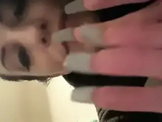 Licking long fingernails