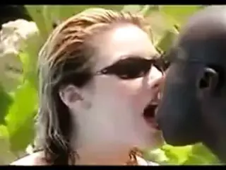 Hot interraical tongue kissing by the pool