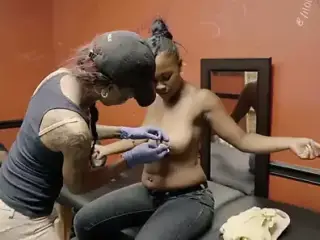 Ebony with saggy tits gets her nipples pierced