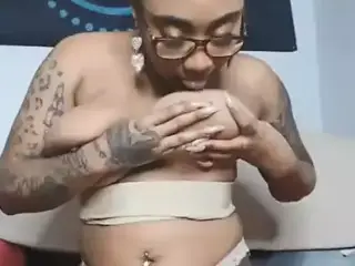 Enjoying her own nipples hastily