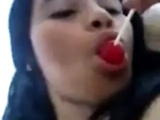 masturbating and licking lollipop