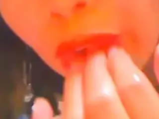 Chick likes to fill her mouth and pussy with her hand