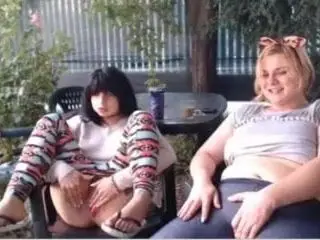 Two girls playing in public