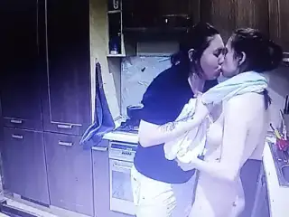 Two young lesbian girls kiss and have sex together