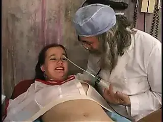 Cute brunette's breasts are tortured and pussy stretched by a speculum