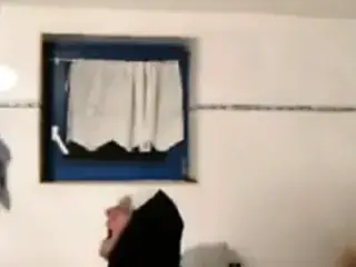 Old man having a nun fantasy at a hotel