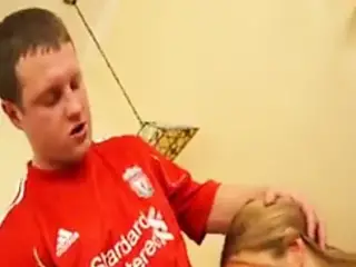 Liverpool supporter in St Petersburg giving facial