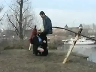 Redhead student sucks on the banks of the river for all to s