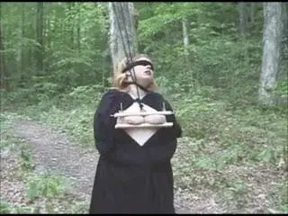 BBW has hard bondage in the forest.