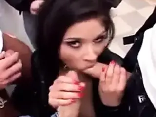 dark haired babe in fishnet stockings gets into gang bang