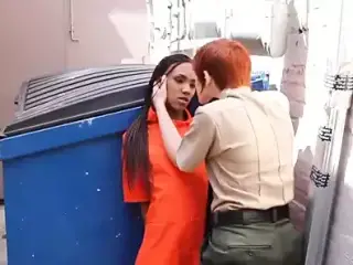 Prison Guard behind dumpster