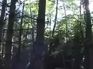French girl with 2 men in forest