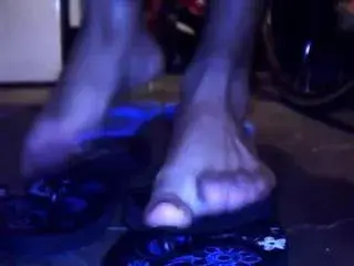 Feet in black sandals