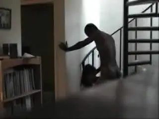 Sucking black cock by the stairs