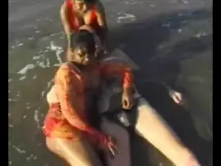 2 Indian girls with white guy in beach have fun blowjob..