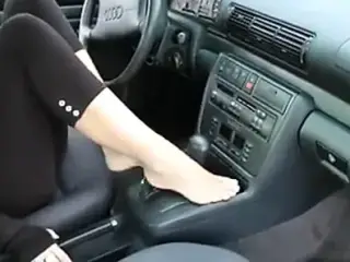 Beautiful feet in a car