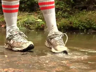 Caroline New Balance sneaker hike with mud and water preview