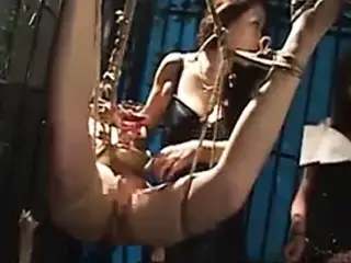 Bound Asian chick endures a nasty BDSM threesome