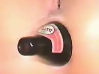 Horny slut fucks her ass with beer bottle