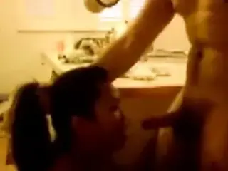 asian takes a facial in the kitchen
