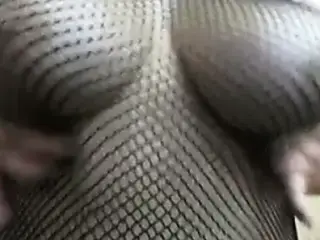 Fishnet bodystocking tease