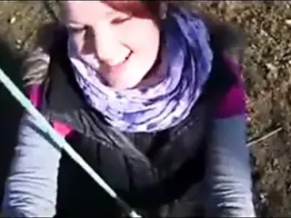 Young redhead outdoor handjob
