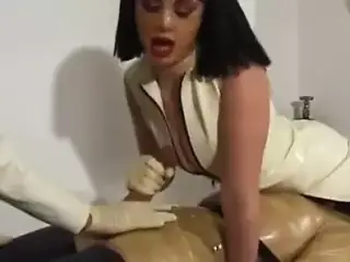 Two Slutty Masked Latex Nurses Jerk Off Helpless Patient